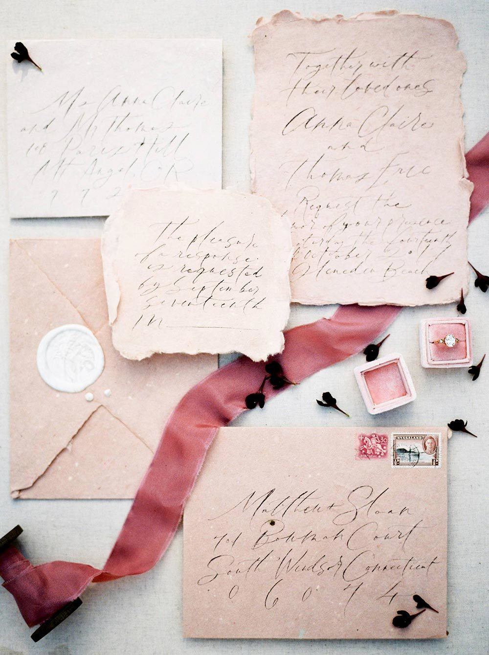 pink wedding invitations with scripty calligraphy