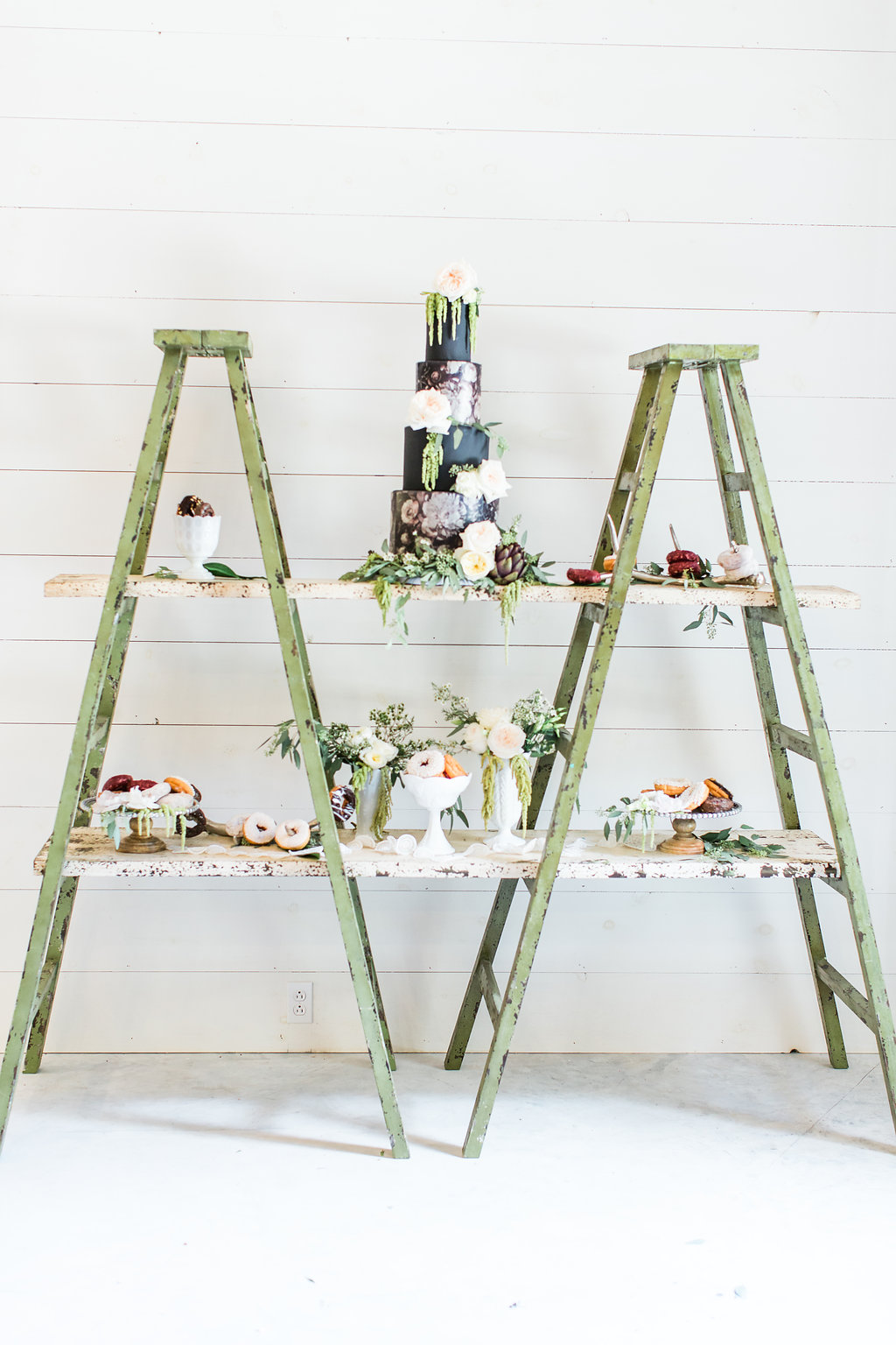 cake table with ladders - photo by Olivia Morgan Photography https://ruffledblog.com/crisp-southern-elegance-makes-for-perfect-wedding-inspiration