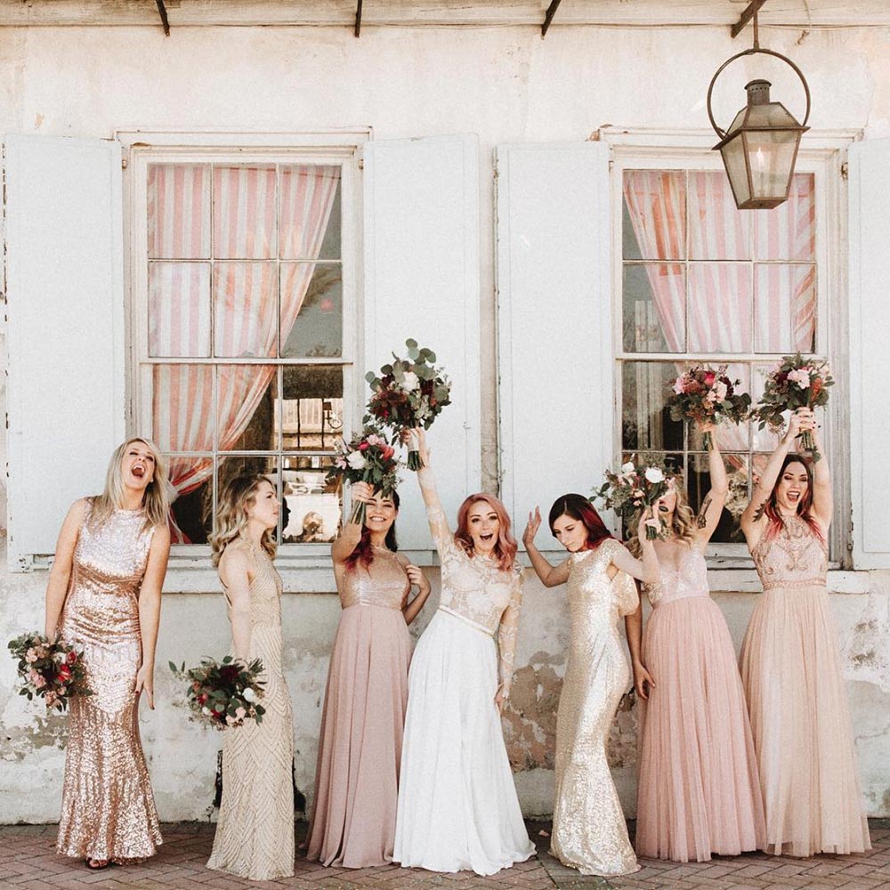 mismatched bridesmaid dresses and bride with pink hair