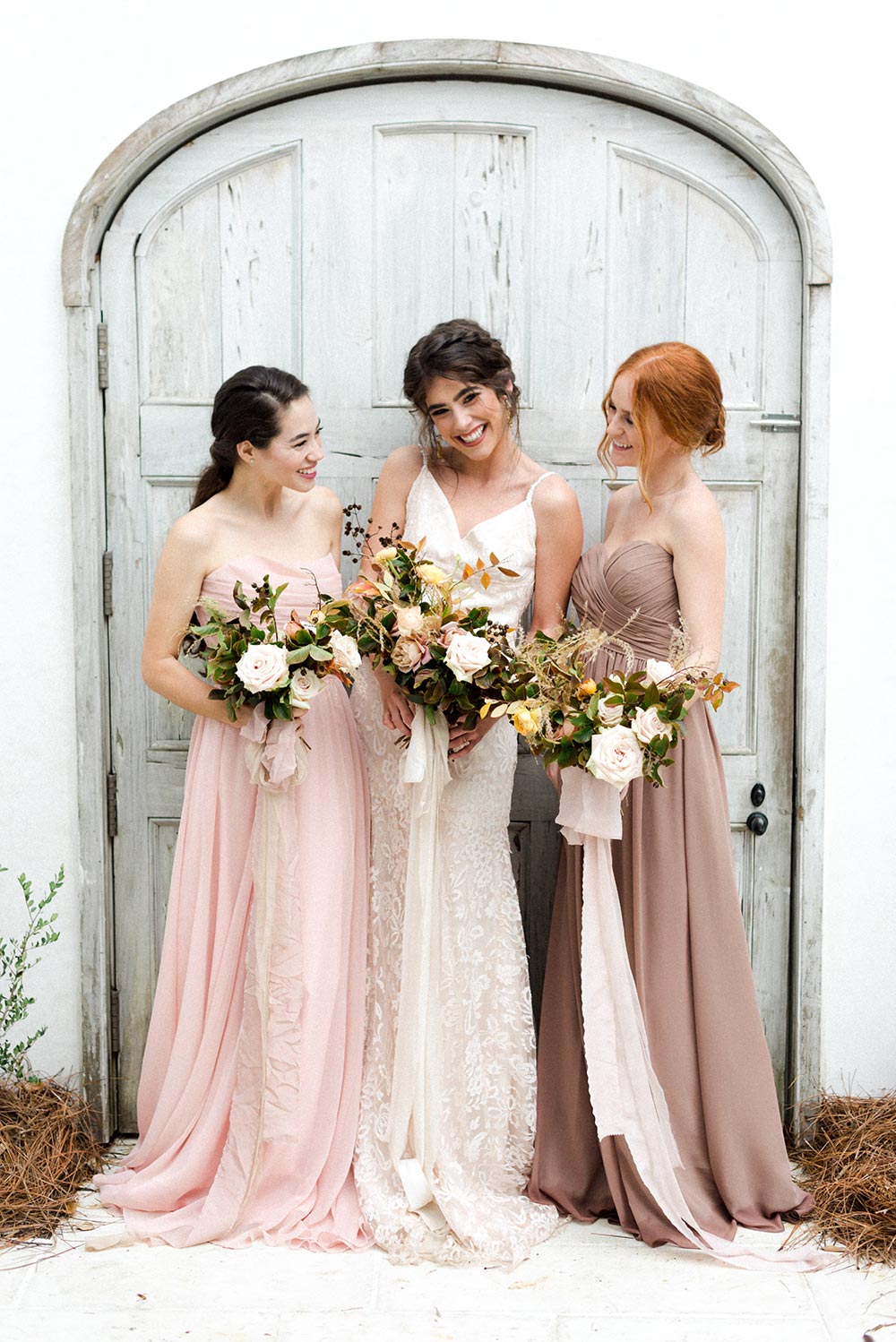 neutral mismatched bridesmaid dress with loose bouquets